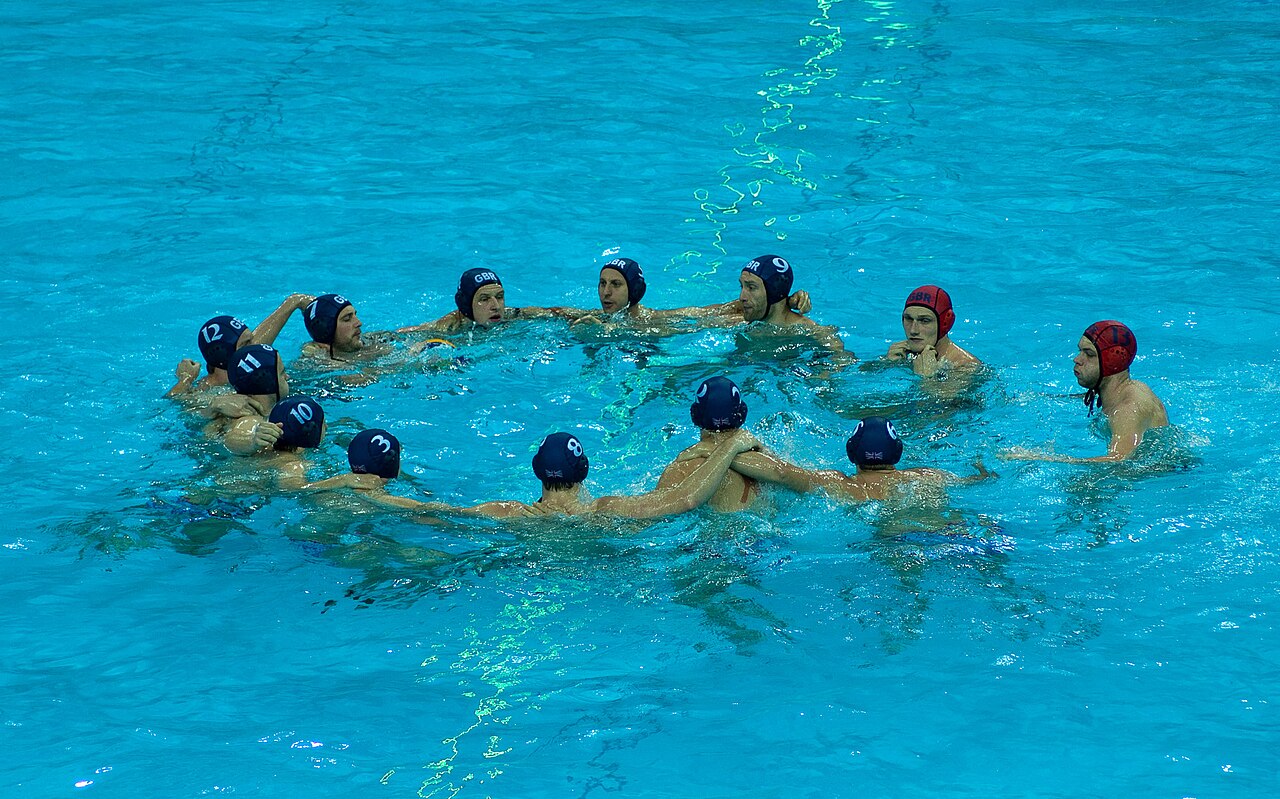 Water polo team huddle